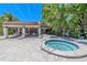Soothing hot tub beside a pavilion, perfect for unwinding within the beautiful community pool area at 3505 Tarpon Woods Blvd # N405, Palm Harbor, FL 34685