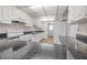 The kitchen has white cabinets, updated appliances, and dark granite countertops at 3505 Tarpon Woods Blvd # N405, Palm Harbor, FL 34685