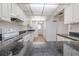 The kitchen has updated appliances, white cabinets, and sleek granite countertops at 3505 Tarpon Woods Blvd # N405, Palm Harbor, FL 34685