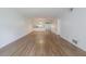 Bright and spacious living room with hardwood floors and views of the kitchen area at 3505 Tarpon Woods Blvd # N405, Palm Harbor, FL 34685