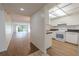 A view into the living space shows an open floor plan with bright light from the lanai at 3505 Tarpon Woods Blvd # N405, Palm Harbor, FL 34685