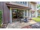 Enjoy outdoor living on this covered patio with a table, chairs, and sliding glass door at 3505 Tarpon Woods Blvd # N405, Palm Harbor, FL 34685