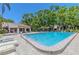 Serene community pool with a covered pavilion and plenty of lounging space for residents to enjoy at 3505 Tarpon Woods Blvd # N405, Palm Harbor, FL 34685