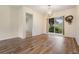 Dining room with hardwood floors and sliding glass door providing plenty of light at 3604 Arlington Oaks Ct, Tampa, FL 33618