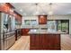Spacious kitchen with granite countertops, stainless steel appliances, and center island at 3604 Arlington Oaks Ct, Tampa, FL 33618