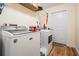 Laundry room equipped with a washer and dryer next to the backdoor entrance at 3604 Arlington Oaks Ct, Tampa, FL 33618