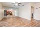 Spacious living room with hardwood floors and mirrored wall reflecting the kitchen at 3604 Arlington Oaks Ct, Tampa, FL 33618