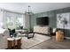 Elegant living room featuring modern furniture, designer lighting, and a neutral color palette at 37255 Sagemoor Dr, Zephyrhills, FL 33541