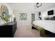 Serene main bedroom with elegant furnishings, soft lighting, and calming decor for relaxation at 37255 Sagemoor Dr, Zephyrhills, FL 33541