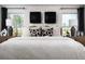 Well-lit main bedroom with minimalist design, decorative pillows, and natural light at 37255 Sagemoor Dr, Zephyrhills, FL 33541
