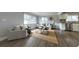 Open living area showcasing hardwood floors, neutral paint, and seamless flow to the kitchen at 3763 Darthmouth N Ave, St Petersburg, FL 33713