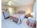 Cozy bedroom features tiled floors, a decorative bed frame, and soft pastel colored walls at 3845 Edgemont Dr, New Port Richey, FL 34652