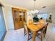 Dining room features a light fixture, a wooden table, and seating for four people at 3845 Edgemont Dr, New Port Richey, FL 34652