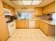 Bright kitchen with ample counter space, well-lit cabinetry, and modern appliances at 3845 Edgemont Dr, New Port Richey, FL 34652