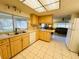 Well-lit kitchen with ample counter space, and view to living area for seamless entertaining at 3845 Edgemont Dr, New Port Richey, FL 34652