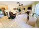 Spacious living room with tile flooring, a fireplace, comfortable seating, and ample natural light at 3845 Edgemont Dr, New Port Richey, FL 34652