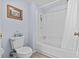 Bathroom with a white bathtub, tiled shower, and blue painted walls at 39650 Us Highway 19 N # 553, Tarpon Springs, FL 34689