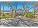 Inviting community center surrounded by lush landscaping and mature trees, creating a welcoming atmosphere at 39650 Us Highway 19 N # 553, Tarpon Springs, FL 34689