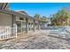 Community deck area with blue lounge chairs and mature palms at 39650 Us Highway 19 N # 553, Tarpon Springs, FL 34689