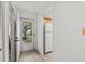 Bright entryway featuring vinyl flooring and a view into the kitchen at 39650 Us Highway 19 N # 553, Tarpon Springs, FL 34689