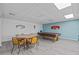 The game room has a pool table and a card table to create an entertaining space at 39650 Us Highway 19 N # 553, Tarpon Springs, FL 34689