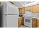 Functional kitchen with white appliances and ample cabinet space at 39650 Us Highway 19 N # 553, Tarpon Springs, FL 34689