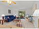 Bright living room featuring access to the porch, modern furnishings and plenty of room at 39650 Us Highway 19 N # 553, Tarpon Springs, FL 34689