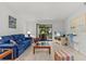 Inviting living room with plenty of seating and sliding glass doors to the patio at 39650 Us Highway 19 N # 553, Tarpon Springs, FL 34689