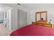 Well lit main bedroom with a full closet and connecting hall to the rest of the house at 39650 Us Highway 19 N # 553, Tarpon Springs, FL 34689