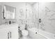 Elegant bathroom with a white marble shower, a toilet, and a decorative accent on the wall at 4120 W North A St # 2, Tampa, FL 33609