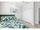 This light-filled bedroom features a leafy-green comforter and a closet for storage at 4120 W North A St # 2, Tampa, FL 33609