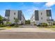 Exterior view of modern townhomes with well-maintained landscaping and brick driveways at 4120 W North A St # 2, Tampa, FL 33609