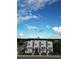 An aerial view showcases the townhome's modern architecture, landscaping, and urban surroundings at 4120 W North A St # 2, Tampa, FL 33609
