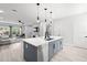 Open kitchen with gray island, modern appliances, and access to the living area at 4120 W North A St # 2, Tampa, FL 33609