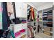 Spacious walk-in closet with custom shelving, ample storage, and organized layout at 4120 W North A St # 2, Tampa, FL 33609