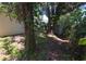 Backyard featuring mature trees, a shed, and plenty of shade at 4607 N 35Th St, Tampa, FL 33610