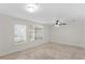 Tile flooring, modern lighting fixtures, and large windows characterize this well-lit and open basement space at 512 S Glen Ave, Tampa, FL 33609