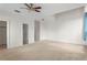 Spacious bedroom with carpet, ceiling fan, and closet entrance at 512 S Glen Ave, Tampa, FL 33609