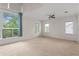 Large bedroom with carpet, ceiling fan, and lots of natural light at 512 S Glen Ave, Tampa, FL 33609