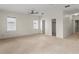 Large bedroom with carpet, ceiling fan, and closet entrance at 512 S Glen Ave, Tampa, FL 33609