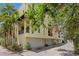 Rear exterior showcasing the building's architecture, including garage access and private balconies for each unit at 512 S Glen Ave, Tampa, FL 33609