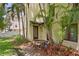 Charming home entrance with well-manicured landscaping, a covered entryway, and clear address display at 512 S Glen Ave, Tampa, FL 33609