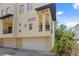Exterior shot showing the architectural details of the multi-level home with garage and balcony at 512 S Glen Ave, Tampa, FL 33609