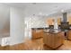 Large kitchen with hardwood floors, two islands, stainless steel appliances, and ample cabinetry at 512 S Glen Ave, Tampa, FL 33609