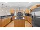 Contemporary kitchen featuring a center island, stainless steel appliances, and stylish cabinetry at 512 S Glen Ave, Tampa, FL 33609