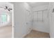 Spacious walk-in closet offering ample storage with shelving, rods, and room to organize personal belongings at 512 S Glen Ave, Tampa, FL 33609