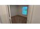 Bright bedroom features a window providing natural light and cozy carpeted floors at 5407 Kedgewick Ln, North Port, FL 34288