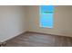 Simple bedroom with carpeted floors and a bright window at 5407 Kedgewick Ln, North Port, FL 34288