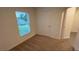 Inviting bedroom features a sunlit window and plush carpeting, perfect for relaxation at 5407 Kedgewick Ln, North Port, FL 34288
