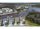Aerial view of a waterfront home, featuring a private boat dock and stunning water views at 5413 Wishing Arch Dr, Apollo Beach, FL 33572